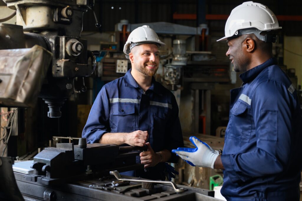 Two industrial engineers team with safety uniform